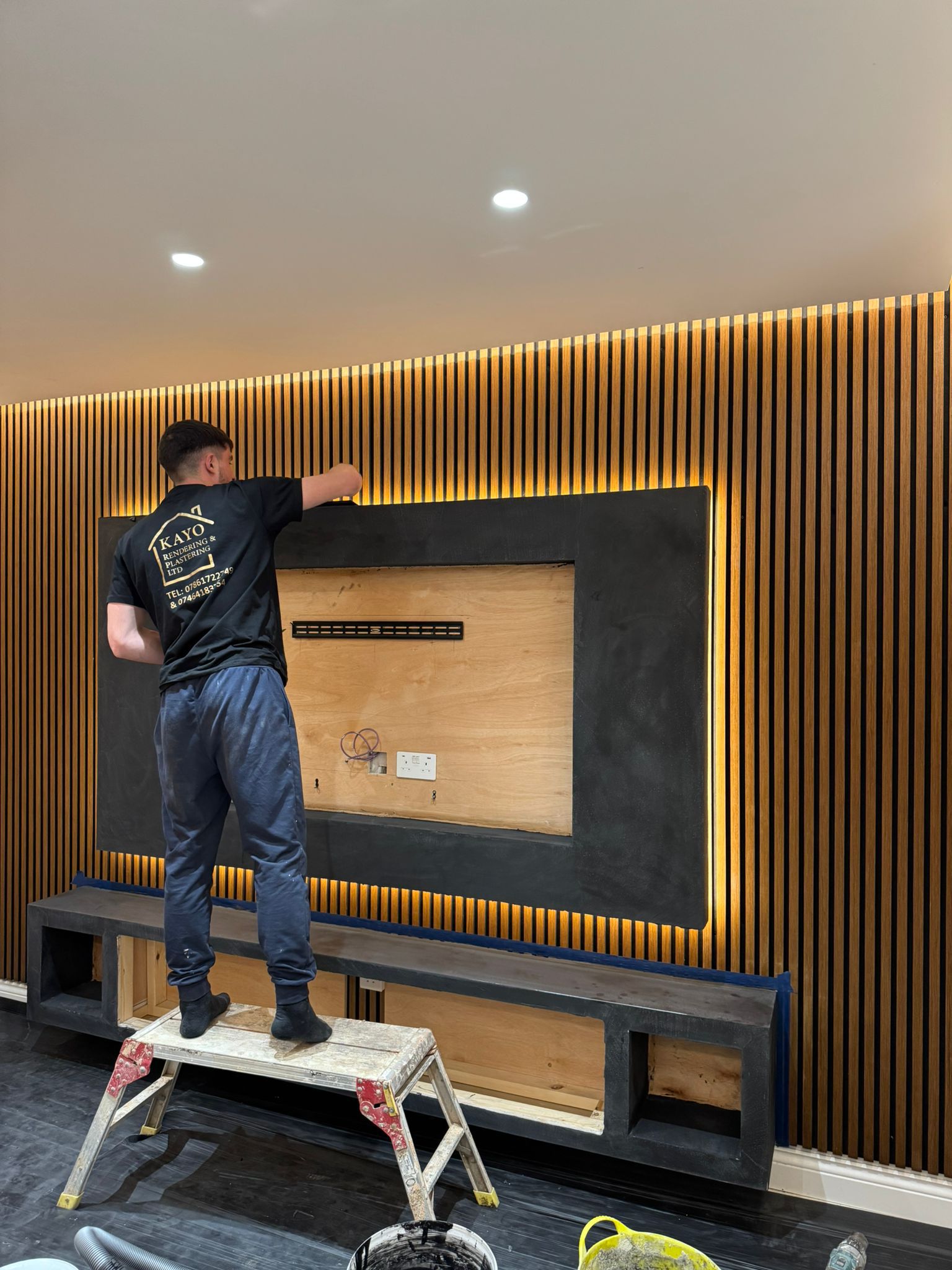 Kayo plasterer finishing a Venetian media wall