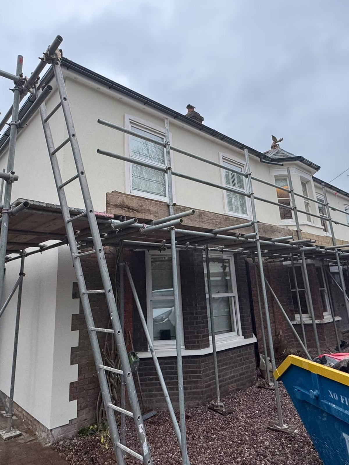 The same extension finished in fresh white silicone render