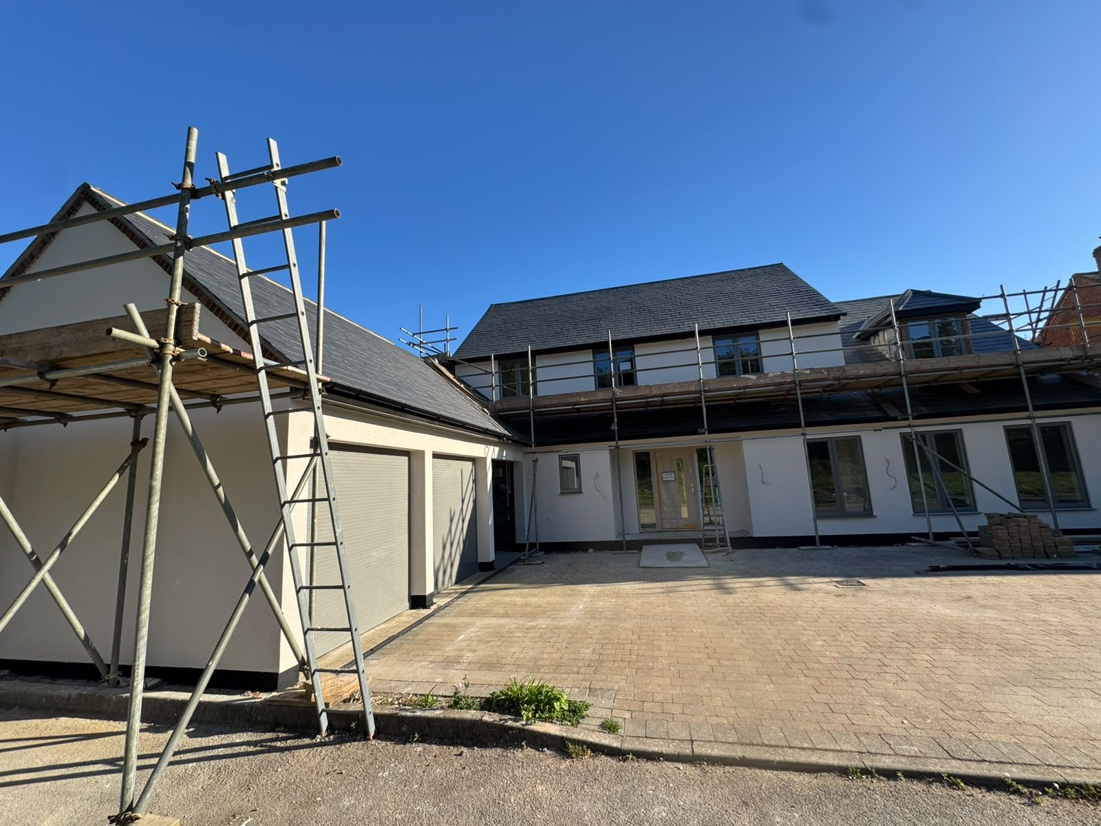 Completed white render on a full house renovation